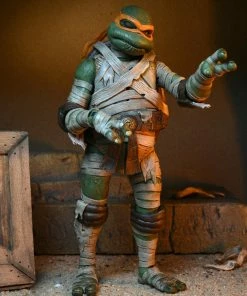 Teenage Mutant Ninja Turtles X Universal Monsters – 7" Action Figurine – Ultimate Michelangelo As The Mummy - NECA Collectibles